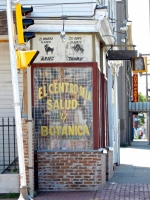 Signs for El Centro de la Salud y Botanica