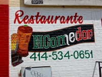 Cone of meat and sign on wall, Restaurante El Comedor