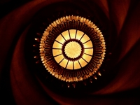 Light at center of spiral ceiling, Antoni Gaudí's Casa Batlló, Barcelona