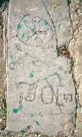 Autograph rock: Skull, Genny, Joe G and others.  Lost. Chicago lakefront stone carvings between Belmont and Diversey Harbors. 2002