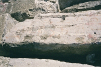 Thin figure with BOR A (upper right). Chicago lakefront stone carvings between Belmont and Diversey Harbors. 2002