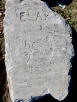 Autograph rock: P + Elay, BC 35, Bun, A.S. and others. Chicago lakefront stone carvings, between Belmont and Diversey Harbors. 2019