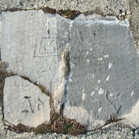 Ad, BS in a box, heart, others. Chicago lakefront stone carvings, Diversey Harbor. 2024