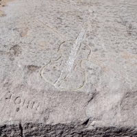 Violin, John, at the entrance to Diversey Harbor. Carving made 2021-2. Chicago lakefront stone carvings. 2022