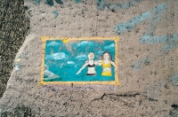 Swimmers. Chicago lakefront stone paintings, between Belmont and Diversey Harbors. 2002