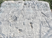 O Sol O Mio, Sun, Drink To Me Only WIth Thine Eyes, skull, flag and more. Chicago lakefront stone carvings, between Belmont and Diversey Harbors. 2011. Still visible