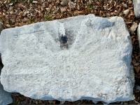 Sun, obscured by white paint. Chicago lakefront stone paintings, between Belmont and Diversey Harbors. 2024