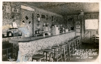 The bar at the Bottle Cap Inn. The wall behind it was gone by the end of 1940