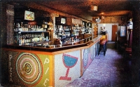 A color shot of the Bottle Cap Inn's interior. The bar and interior configuration under Steve VIscount's ownership are quite different from older images. It's nice to see that at this point someone was still creating more bottle-cap art