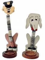Pair of tall cartoon dog bottle-cap figures - vernacular art