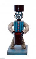 Blue bottle-cap figure with carved mouth and painted eyebrows- vernacular art