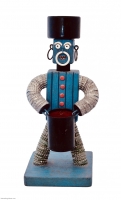 Blue bottle-cap figure with carved mouth and painted eyebrows- vernacular art Blue bottle-cap figure with carved mouth and painted eyebrows- vernacular art