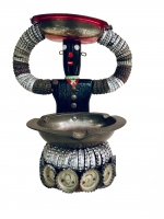 Seated black bottle-cap figure with base lined with Green Bay Packers bottle caps - vernacular art Seated black bottle-cap figure with base lined with Green Bay Packers bottle caps - vernacular art