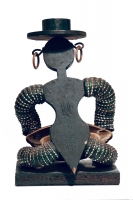 Seated black bottle-cap figure with hat, rear view - vernacular art Seated black bottle-cap figure with hat, rear view - vernacular art