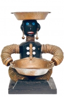 Seated black bottle-cap figure with carved mouth, bottle-cap ears and chain earrings - vernacular art