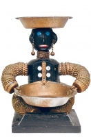 Seated black bottle-cap figure with carved mouth, bottle-cap ears and chain earrings - vernacular art Seated black bottle-cap figure with carved mouth, bottle-cap ears and chain earrings - vernacular art