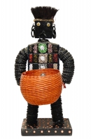 Black bottle-cap figure with paint-brush hair and colored beads on the body - vernacular art