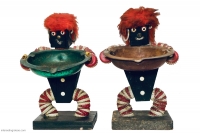 Pair of black figures with red and white bottle caps and red fright wigs- vernacular art