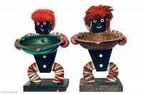 Pair of black figures with red and white bottle caps and red fright wigs- vernacular art Pair of black figures with red and white bottle caps and red fright wigs- vernacular art