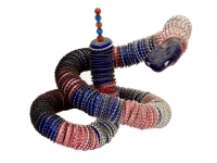 Bottle-cap snake with beaded tail and wooden head