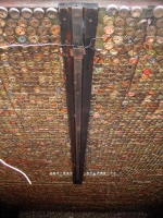 Interior of shed covered  with bottle caps - vernacular art environment