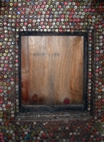 Interior of shed covered  with bottle caps - vernacular art environment