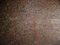 Interior of shed covered  with bottle caps - vernacular art environment