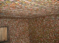 Interior of shed covered  with bottle caps - vernacular art environment