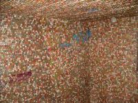 Interior of shed covered  with bottle caps - vernacular art environment