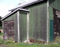 Exterior of Stevens Point, Wisconsin,  shed covered  inside with bottle cap - vernacular art environment