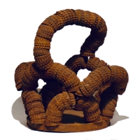 Non-functional brown  basket-like bottle-cap construction  - vernacular art