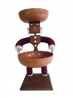 Brown bottle-cap figure with tapered body and painted mouth - vernacular art