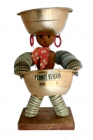 Small brown bottle-cap figure with round head,  bow and Peanut Vendor label - vernacular art
