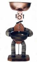 Brown  bottle-cap figure with waffle-pattern incised body,  bowtie and support wire  - vernacular art