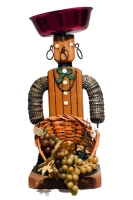 Brown bottle-cap figure with incised body, necklace and bowtie and  holding basket of fruit - vernacular art