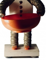 Pair of robot-style bottle-cap figures with feet, detail - vernacular art