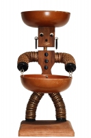 Brown figure with copper bottle caps and tapered body - vernacular art