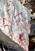 Red creature. Chicago lakefront stone drawings, Northerly Island. 2019