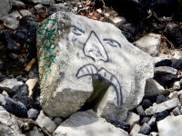 Face. Chicago lakefront stone drawings, Northerly Island. 2019