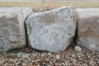 Damaged letters. Chicago lakefront stone carvings, at 44th Street, south of Oakwood Beach. 2022