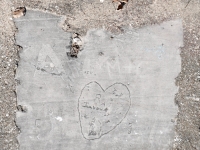 Heart with Randy, various letters and a swastika, C, EY, Billy. Chicago lakefront stone carvings, Calumet Park. 2024 Heart with Randy, various letters and a swastika, C, EY, Billy. Chicago lakefront stone carvings, Calumet Park. 2024