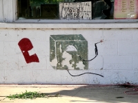 Welding equipment  detail from painted facade, D.J. Auto Sales, next to A Auto Repair-Roadside Art