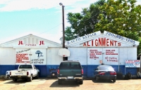 Storefront signage with a wide variety of typography , J&L Alignments, Federal Blvd., Denver, Colorado-Roadside Art