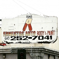 Mystery tool on sign for Ernesto's Auto Body & Paint, Phoenix-Roadside Art