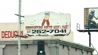 Mystery tool on sign for Ernesto's Auto Body & Paint, Phoenix-Roadside Art