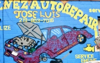 Crazily painted wall sign of car with V-8 engine.. Jimenez Auto Repair, Calumet Avenue, Hammond=Roadside Art