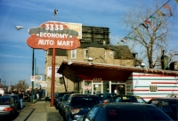 Economy Auto Mart pole sign with car shape, Western Avenue near Roscoe. Formerly a hamburger sign and stand-Roadside Art