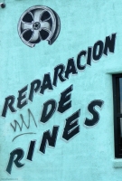 Broken wheel rim and all sign for Yareal Auto Sound, Federal Blvd., Denver, Colorado-Roadside Art