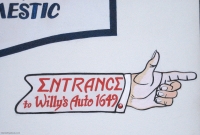 Painted arm pointing to entrance for Willy's Auto, San Francisco-Roadside Art