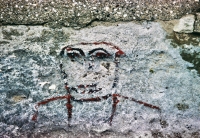 Face. Probably Foster Avenue Beach area. Chicago lakefront stone carvings. 1998